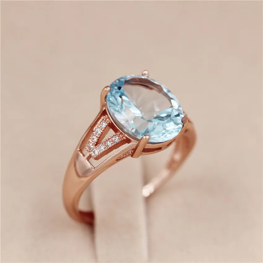 Women's Almei Light Blue Topaz Zircon Ring with CZ Stone 925 Sterling Silver Rose Gold